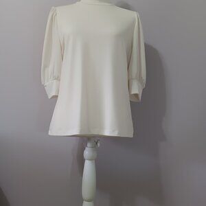 Ivory mock-neck, shortsleeve top